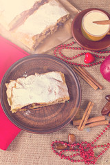 Apple strudel, apple pie and a cup of coffee. The atmosphere for a cozy romantic evening. Valentine's day.