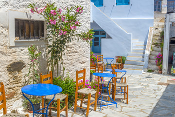 Traditional greek tavern in the narrow streets of Mykonos, Greec