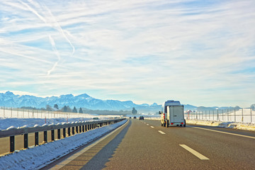 View of road with mini van in Switzerland in winter