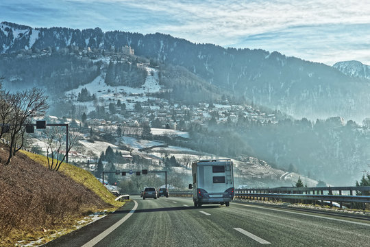 View of road with caravan in Switzerland in winter