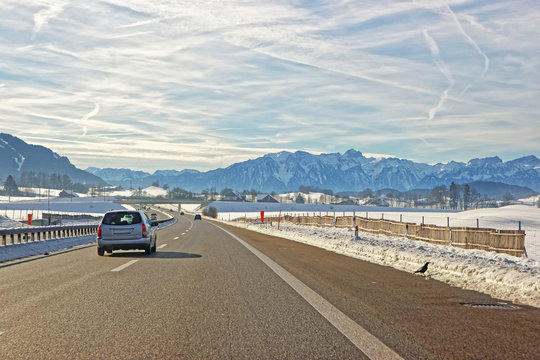 View of road with car in Switzerland in winter