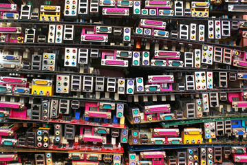 Old computer motherboards. Piles of obsolete hardware and electronic components.