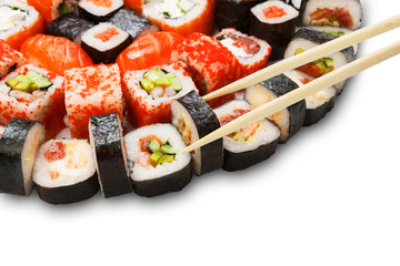 Set of sushi, maki and rolls isolated closeup with chopsticks