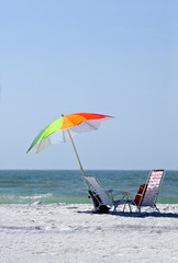 Obraz na płótnie Canvas Beach chairs and umbrella on St. Pete Beach Florida.