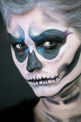  girl in the image of a skeleton on a black background