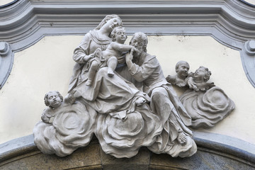 Holy Family statue on the house facade in Graz, Austria