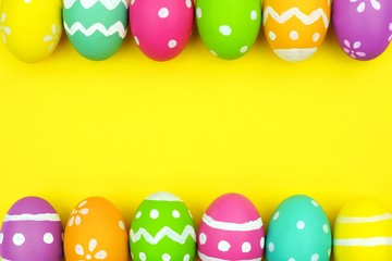 Colorful Easter egg double border over a yellow paper background