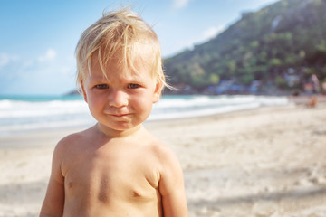 Portrait of little toddler on a beach