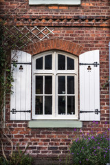 Fototapeta na wymiar Cottage Window Shutters