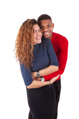 Naklejka premium Happy mixed race couple hugging over a white background