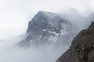 Rocky foggy mountain peak