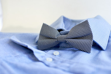 blue shirt with bow tie close-up