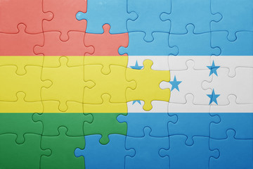 puzzle with the national flag of honduras and bolivia