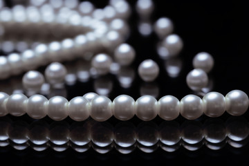 beautiful pearls on black background