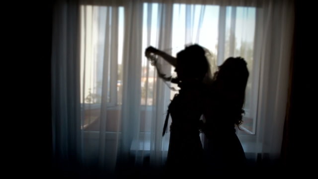 The bride prepares for wedding. Marriage, bride dress veil. Silhouette of a bride. Female, miss, lady