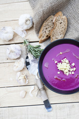 Beet soup with garlic and rosemary, rye baguette 