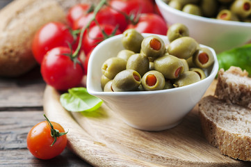 Spanish olives on the wooden table