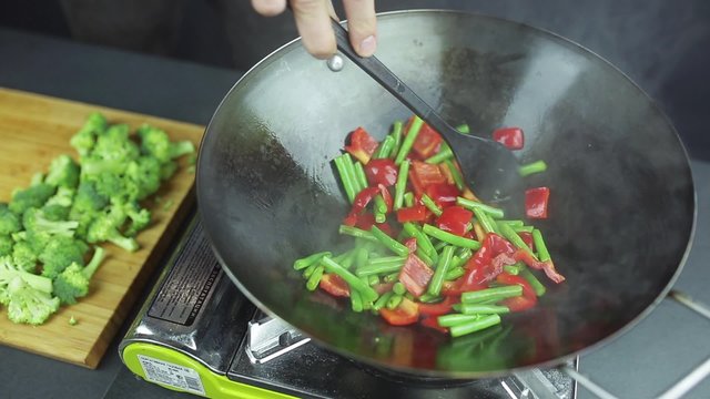 man preparing curry vegetables