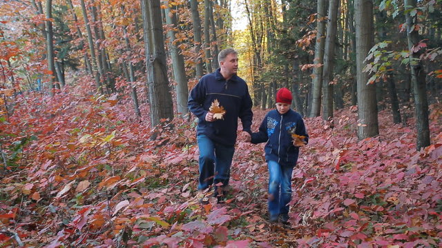 father and son, Child teen walking in a autumn  forest. Childhood dreams and memories.Travel, Tour, trip and tourism.