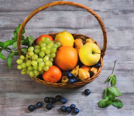 Wicker straw basket with an assortment of fruits