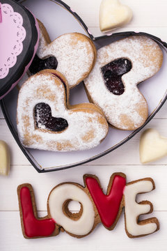Cookies in the shape of a heart and an inscription love