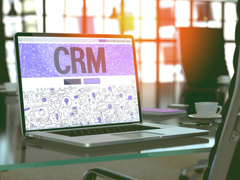 CRM - Customer Relationship Management - Concept - Closeup on Landing Page of Laptop Screen in Modern Office Workplace. Toned Image with Selective Focus. 3d Render.
