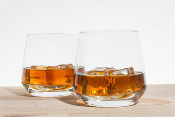 iced wiskey on the wood floor, white backround