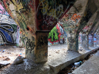 Painted cement foundation inside abandoned factory - landscape photo