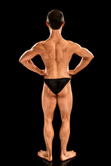 Obraz na płótnie Canvas Bodybuilder Posing on Black
