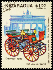 Fototapeta na wymiar First car of Daimler (1886) on postage stamp