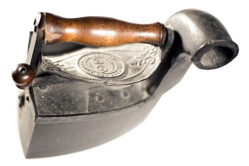 Old and heavy iron on a white background