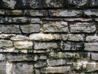 Old Wall with white stones and moss