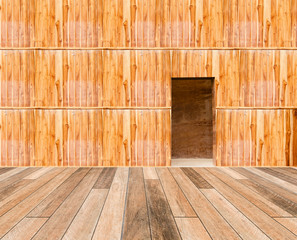 wooden wall with door and wood floor in front off
