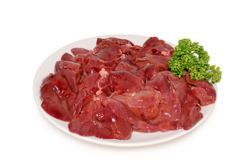 Fresh raw chicken livers on the plate against a white background