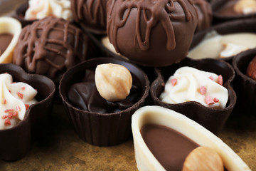 Chocolate sweets on a metal tray, closeup