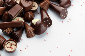 Assorted chocolate candies, isolated on white
