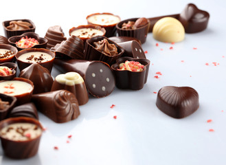 Assorted chocolate candies, isolated on white