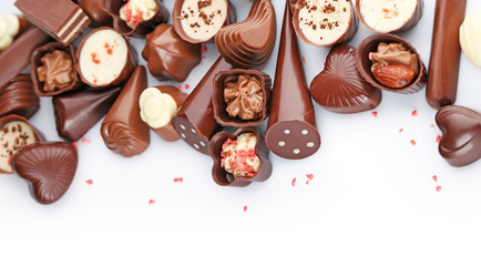 Assorted chocolate candies, isolated on white
