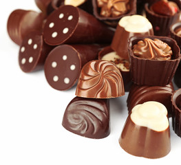Assorted chocolate candies, isolated on white