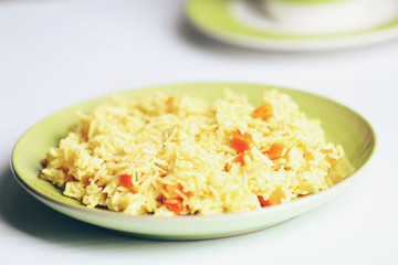 Stewed rice with a carrot on a , close up
