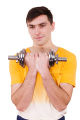 Fototapeta na wymiar Man exercising with dumbbells lifting weights