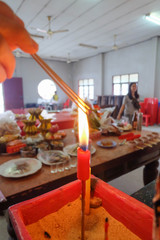 Buring incenses to worship the ancestors
