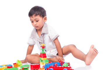 little asian boy play building brick