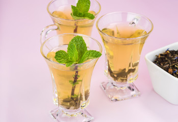 Glass tea cups with green tea.