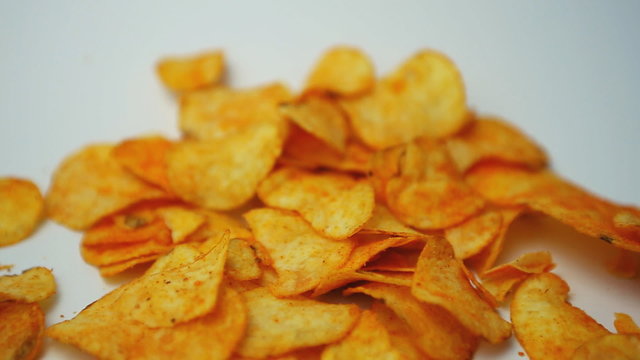 potato chips with paprika (on white background). Fried food in oil. Harmful food, snack.Big belly, overweight, obesity