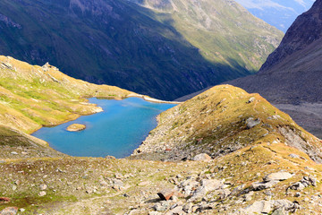 Fototapeta na wymiar Mountain panorama view with lake in Hohe Tauern Alps, Austria