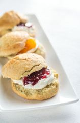 Scones with cream and fruit jam