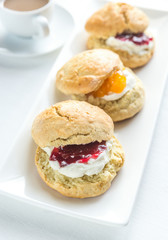 Scones with cream and fruit jam