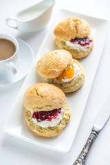 Scones with cream and fruit jam