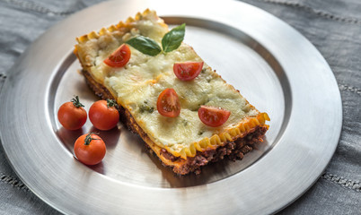 Lasagna on the metal plate: top view